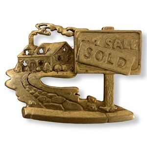 Signed gold-tone Real Estate Brooch Pin